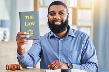 Image showing Happy, man and portrait with a book on the law, rules or research on legal constitution, regulation or policy from government. African businessman, lawyer or attorney with knowledge of justice