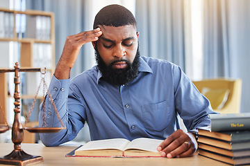 Image showing Black man, lawyer and reading book with stress in office from worry, pain or frustrated with challenge of court case. Confused advocate, attorney and headache from legal research analysis in law firm