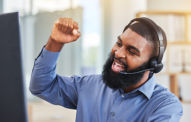 Image showing Call center, success and business man, winner or consultant for target, sales and telemarketing celebration on computer. Professional agent or african worker yes, cheers and fist for telecom goals