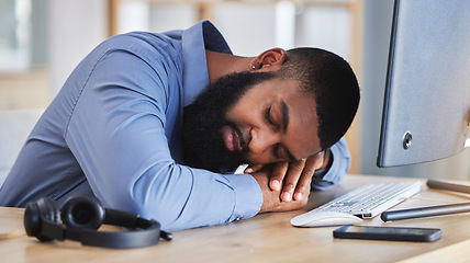 Image showing Call center, tired business man and sleeping at desk with burnout, fatigue and low energy in telemarketing office. Lazy, depressed and stress of african sales consultant taking a nap in CRM agency