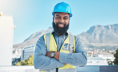 Image showing Construction, portrait and black man in city with arms crossed for building project, site maintenance and civil engineering. Happy contractor, architecture and urban property development in Cape Town