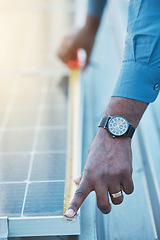 Image showing Engineer, hands and tape to measure solar panel on rooftop for sustainable planning, construction and building grid. Closeup of technician, electrician and man with measurement of photovoltaic system