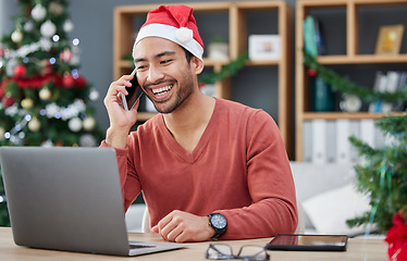 Image showing Phone call, christmas hat and businessman in the office with a laptop on cellphone for communication. Happy, smile and male creative employee with xmas decorations on mobile conversation in workplace