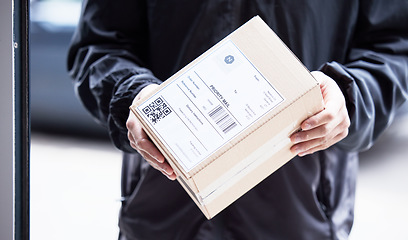 Image showing Box, hands and courier at with mail for a delivery, ecommerce work or cargo shipping. Closeup, logistics and man or person with package, stock or front door freight wholesale or distribution service