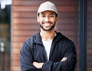 Image showing Arms crossed, portrait and asian man courier outdoor for delivery and service with a smile. Face, proud and happy Japanese male carrier ready for ecommerce, order or logistics, mail or distribution