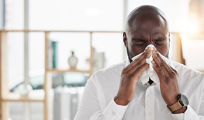 Image showing Sick, tissue and businessman blowing his nose in the office with cold, flu or sinus allergies. Illness, medical and professional young African male person with hayfever while working in the workplace