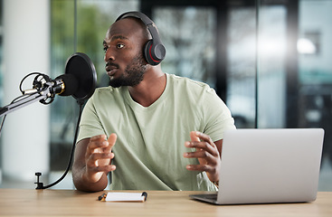 Image showing Black man, microphone and talk show, headphones and radio DJ with news, communication and audio equipment. Podcast, technology and multimedia with male person, laptop with announcement and broadcast