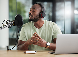 Image showing Black man, microphone and laptop, headphones and radio DJ with news, communication and audio equipment. Podcast, technology and multimedia with male person, talking with announcement and broadcast