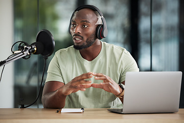 Image showing Black man, microphone and talking with headphones and radio DJ, news with communication and audio equipment. Podcast, laptop and multimedia with male presenter, hosting show and online broadcast