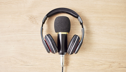 Image showing Audio, microphone and headphones on a table for a podcast, radio or broadcast. Music, above or musical gear, equipment or a mic for live streaming, musician recording or technology in an office