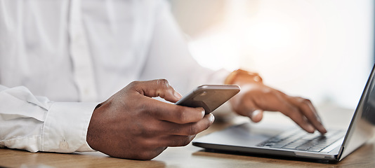 Image showing Hands, business and man with a smartphone, laptop and typing to update software, network and connection. Hand of man, employee or consultant with a pc, cellphone and search internet with app analysis