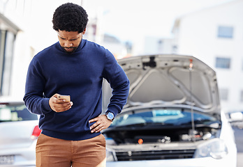 Image showing Black man with phone, car breakdown and typing in road with contact, auto insurance and travel. Motor problem, transport and frustrated driver on road checking mobile app for engine repair service.