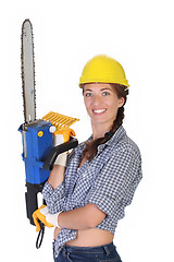 Image showing Beauty woman with chainsaw