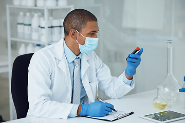 Image showing Science, medical and man with blood work for doctor research and study in clinic. Lab expert, analysis and healthcare professional with hospital notes and writing for laboratory test of scientist