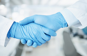 Image showing Team handshake, gloves and lab scientist partnership, agreement or collaboration on medical healthcare project. Laboratory, shaking hands and closeup people teamwork, cooperation and welcome partner