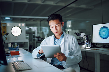 Image showing Tablet, planning and scientist with digital innovation, data and reading in laboratory. Asian man, doctor and information technology for futuristic medical research with pharma healthcare study