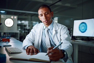 Image showing Doctor, writing and night in laboratory for medical research and study for healthcare report. Paperwork, African male professional and planning with data for biotechnology in a clinic or hospital