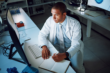 Image showing Doctor, writing and night with computer in laboratory for medical research and study with healthcare. Paperwork, male professional and planning with data for biotechnology in clinic or hospital