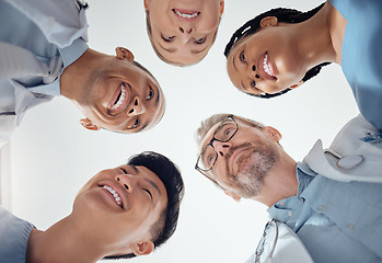 Image showing Doctors, nurses and team, collaboration and huddle with low angle, healthcare service and diversity at hospital. Group of people, meeting and teamwork with health discussion, innovation and strategy