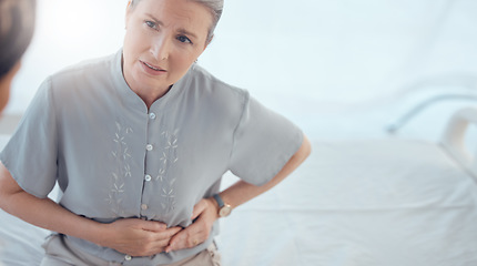 Image showing Healthcare, senior and woman with a doctor and pain from the appendix for a consultation. Stomach pain, hospital and elderly clinic patient speaking to medical professional about an injury or problem