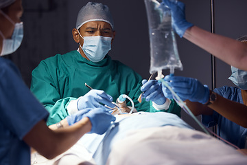 Image showing Surgery teamwork, man and surgeon operation, accident emergency service or helping healthcare patient at night. Clinic collaboration, operating room theater and doctors group doing medical procedure