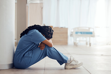 Image showing Healthcare, woman on the floor and stress with depression, intern and panic attack with burnout. Person, medical professional or sad nurse on the ground, mental health issue and anxiety in a hospital