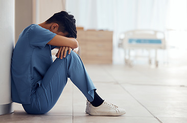 Image showing Healthcare, man on the floor and stress with depression, employee and panic attack with burnout. Person, medical professional and sad doctor with mental health problem and surgery fail in a hospital