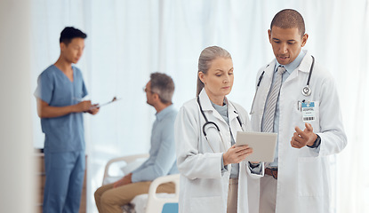 Image showing Doctors, team and man with woman and tablet, medical test results and consultation with collaboration at hospital. Surgeon, teamwork and medical professional with digital surgery plan and healthcare