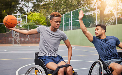 Image showing Sports, basketball and men in wheelchair for training, exercise and workout on outdoor court. Fitness, team and male people with a disability with ball playing for competition, practice and games