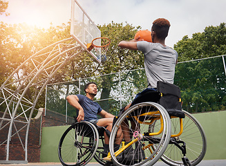 Image showing Wheelchair basketball player, shot and sports people play match competition, challenge or practice game skills, target or goal. Outdoor court, shooting workout and athlete with disability, training