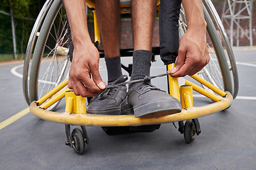 Image showing Fitness, wheelchair and man tie shoes ready for training, exercise and workout on outdoor court. Sports, start and male person with disability tying sneakers for performance, wellness and challenge