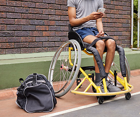 Image showing Sports, wheelchair basketball and a man with a disability on a court for fitness, training or competition. Phone, legs and exercise with a male athlete outdoor for a workout as a game player