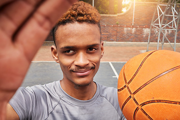 Image showing African man, basketball player and portrait selfie on court for social media, fitness blog or training match vlog. Face, pov or athlete with ball for exercise, workout and sports photography in games