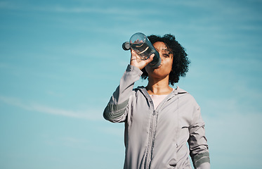 Image showing Woman, drinking water and health with fitness, hydration and workout outdoor. Plastic bottle, liquid and wellness with female athlete in nature, exercise and training with h2o and mockup space