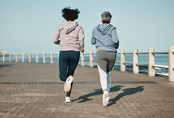 Image showing Back view, beach and friends running for fitness together as morning exercise for wellness and outdoor bonding. Health, endurance and people training for marathon in Cape Town for sports workout