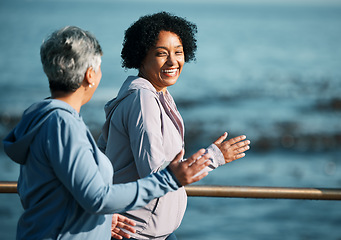 Image showing Running, fitness and senior women at beach happy, wellness and exercise in nature together. Elderly, friends and ladies at sea smile, workout and active retirement, fun or laugh, bond and ocean run