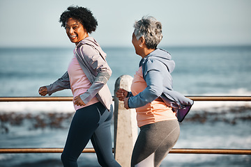 Image showing Fitness, running and senior women by ocean for healthy lifestyle, wellness and cardio on promenade. Sports, friends and happy female people walking on boardwalk for exercise, training and workout