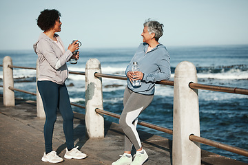 Image showing Fitness, walking and senior women relax by ocean for healthy lifestyle, wellness and cardio on promenade. Sports, friends and female people talking on boardwalk for exercise, training and workout