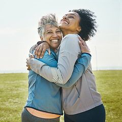Image showing Hugging, fitness and senior women bonding together in an outdoor park after a workout or exercise. Happy, smile and elderly female friends or athletes with love and care after training in nature.