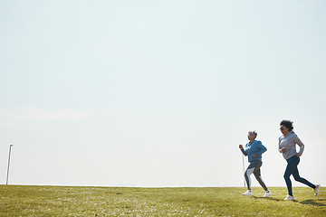 Image showing Women are running, fitness and cardio outdoor with training for marathon with mockup space. Female runner team in park, exercise and triathlon race with sports and athlete, health and wellness