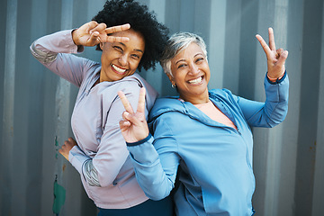 Image showing Fitness, portrait and senior friends with peace sign bonding and posing after workout or exercise together. Happy, fitness and elderly female athletes with hipster hand gesture after training by wall