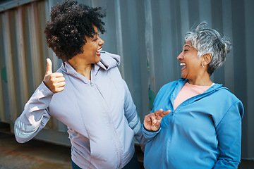 Image showing Happy, sports and senior women friends bonding and posing after a workout or exercise together. Happiness, smile and elderly female athletes with hand signs in sportswear after training by a wall.