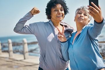 Image showing Mature women, friends and outdoor for peace selfie with fitness, motivation and travel memory. Profile picture, social media and influencer people with smile, adventure and flex arm for strong power