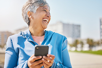 Image showing Funny, phone and fitness with old woman at beach for running, workout and mockup. Network, communication and contact with female runner laughing in nature for technology, sports and mobile app
