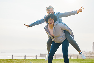 Image showing Beach, funny and senior friends piggyback together doing airplane gesture playing, crazy and laughing at outdoor exercise. Health, wellness and goofy elderly women bonding by the sea for workout