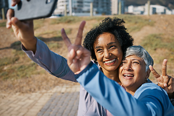 Image showing Friends, mature women and outdoor for peace selfie at a park with motivation and travel memory. Profile picture, social media and influencer people with hands, adventure and happy emoji in Chicago