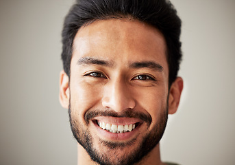 Image showing Face, portrait and smile of happy asian man in studio with positive mindset, wellness and awareness. Face of a young male model isolated on a grey background with happiness and confident headshot