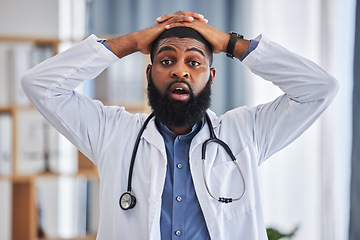 Image showing Black man, portrait and shocked doctor in hospital after announcement, gossip or bad news. Omg, wow and disappointed medical worker with hands on head for surprise or healthcare results in clinic