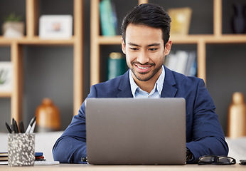 Image showing Man in office with laptop, smile and typing email, proposal or writing online report networking at startup. Happy businessman, computer and administration work for editing, copywriting or web search.