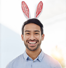 Image showing Bunny ears, holiday and business man portrait with a smile from easter and creative job pride. Celebration, happy and male professional from Spain feeling silly and goofy with comedy hat at office